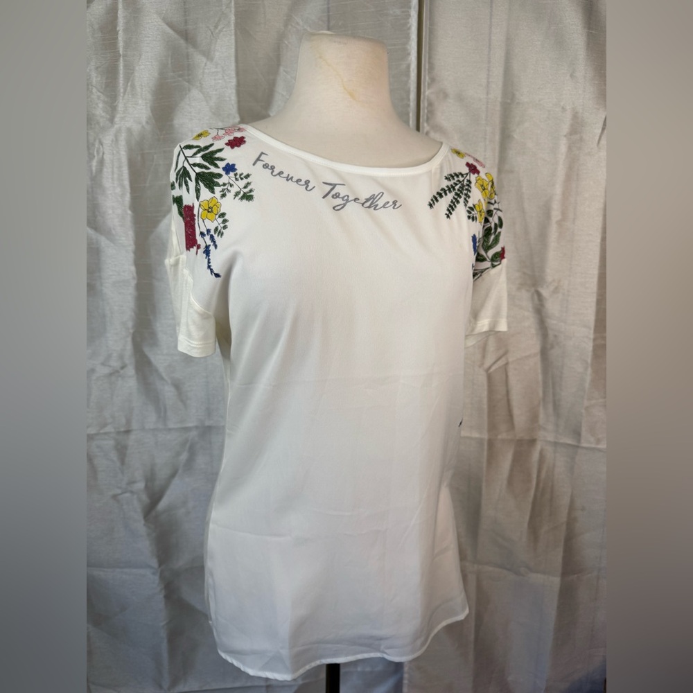 White Top with Floral Accents